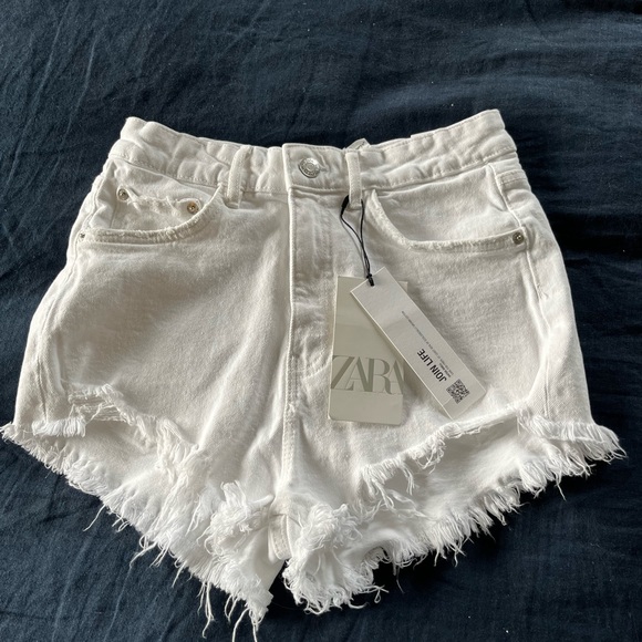 Zara Pants - Zara high-wasted, white-denim shorts.